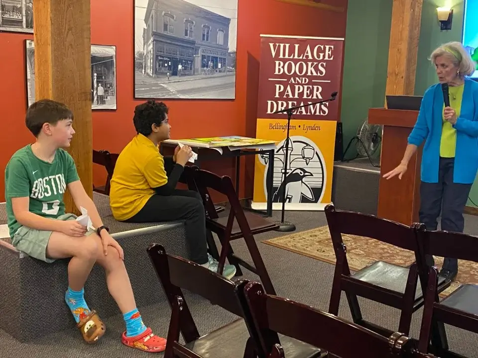 Young fans listening to Kathleen read the story out loud